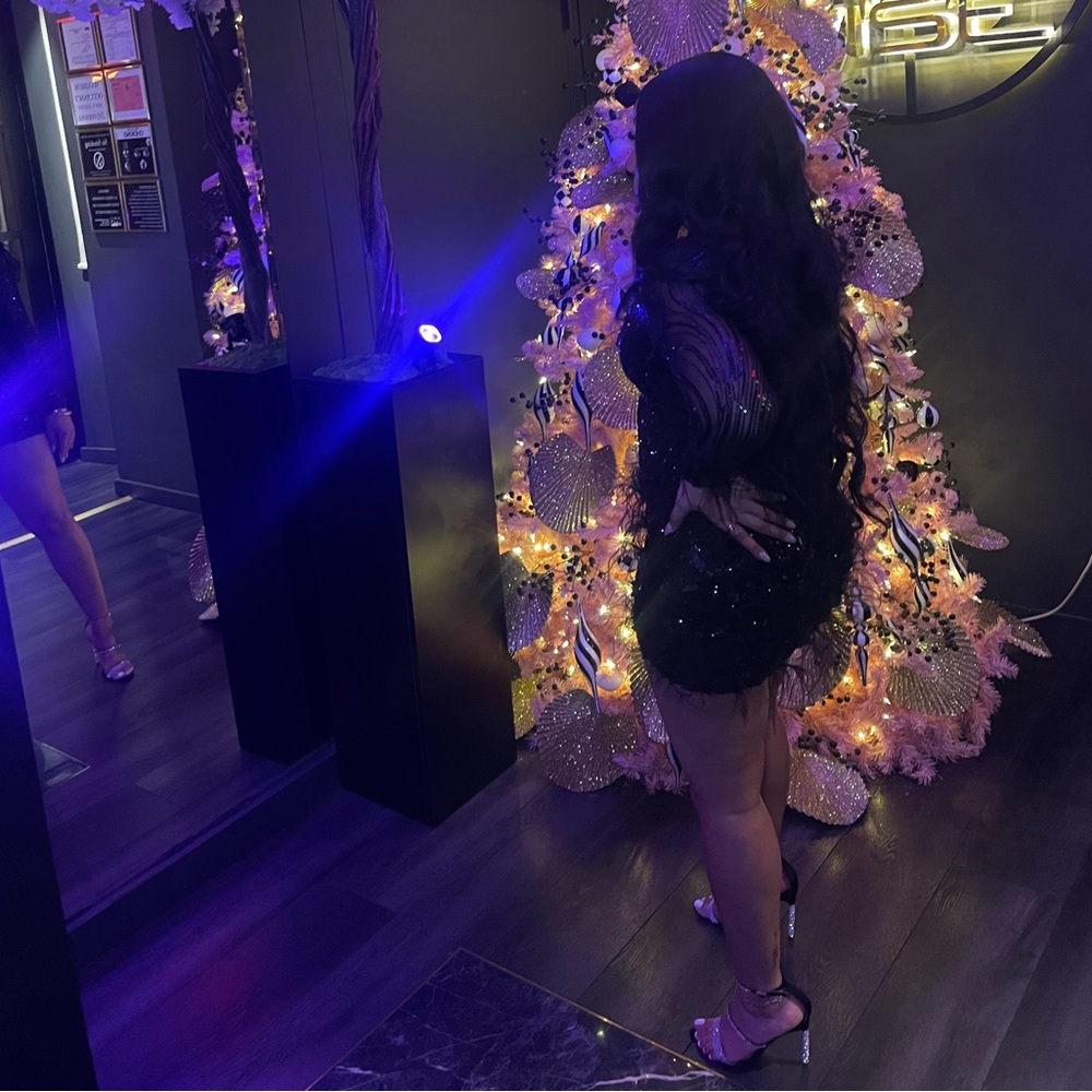 Black sequin and feather dress